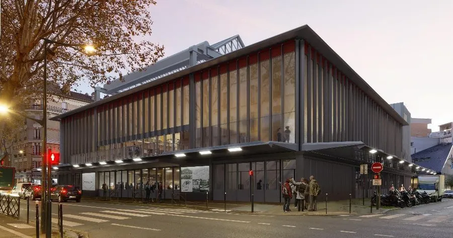 Rendering of the restored facade of the Maison du Peuple in Clichy for Ducasse Paris at dusk, with glass curtain walls