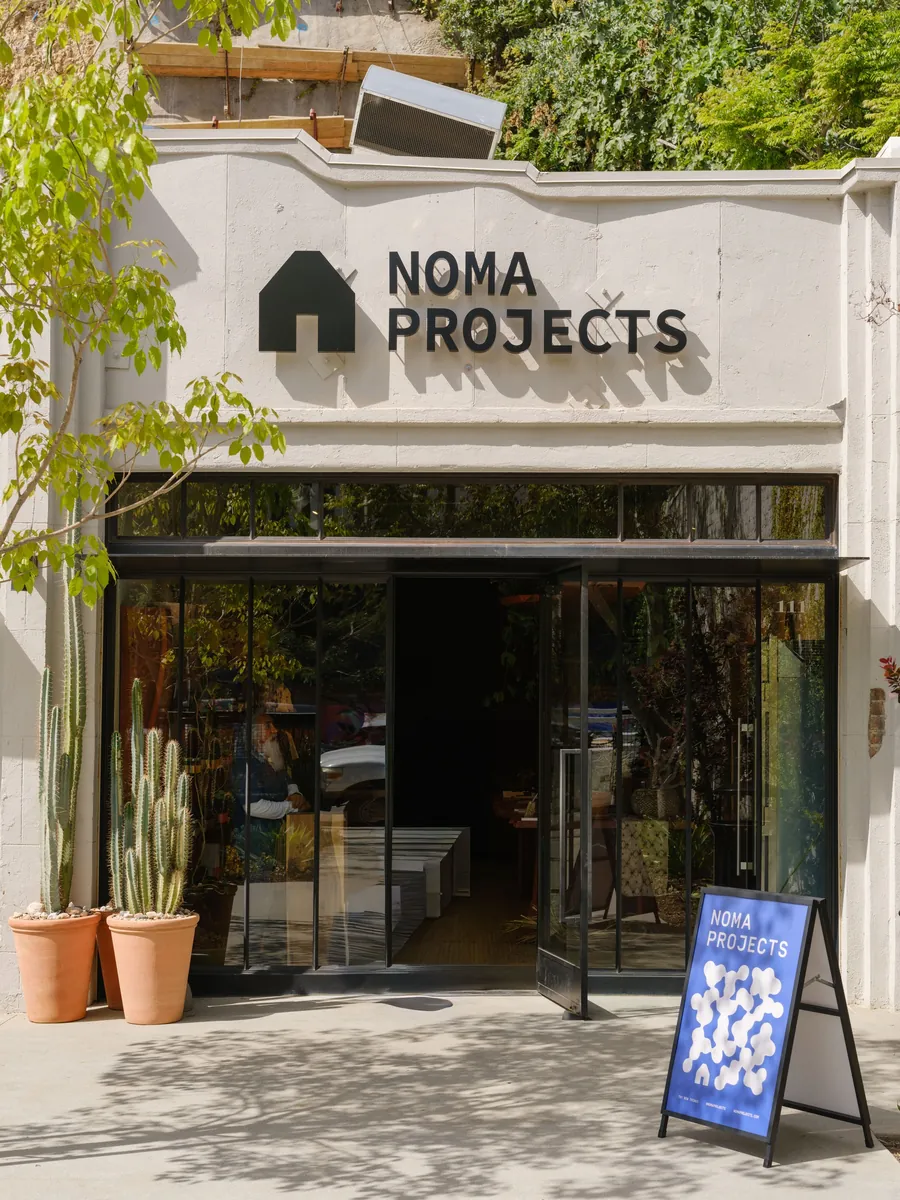 Entrance of the Noma Projects shop at Sunset Row in Silver Lake, Los Angeles, with cacti in terracotta pots